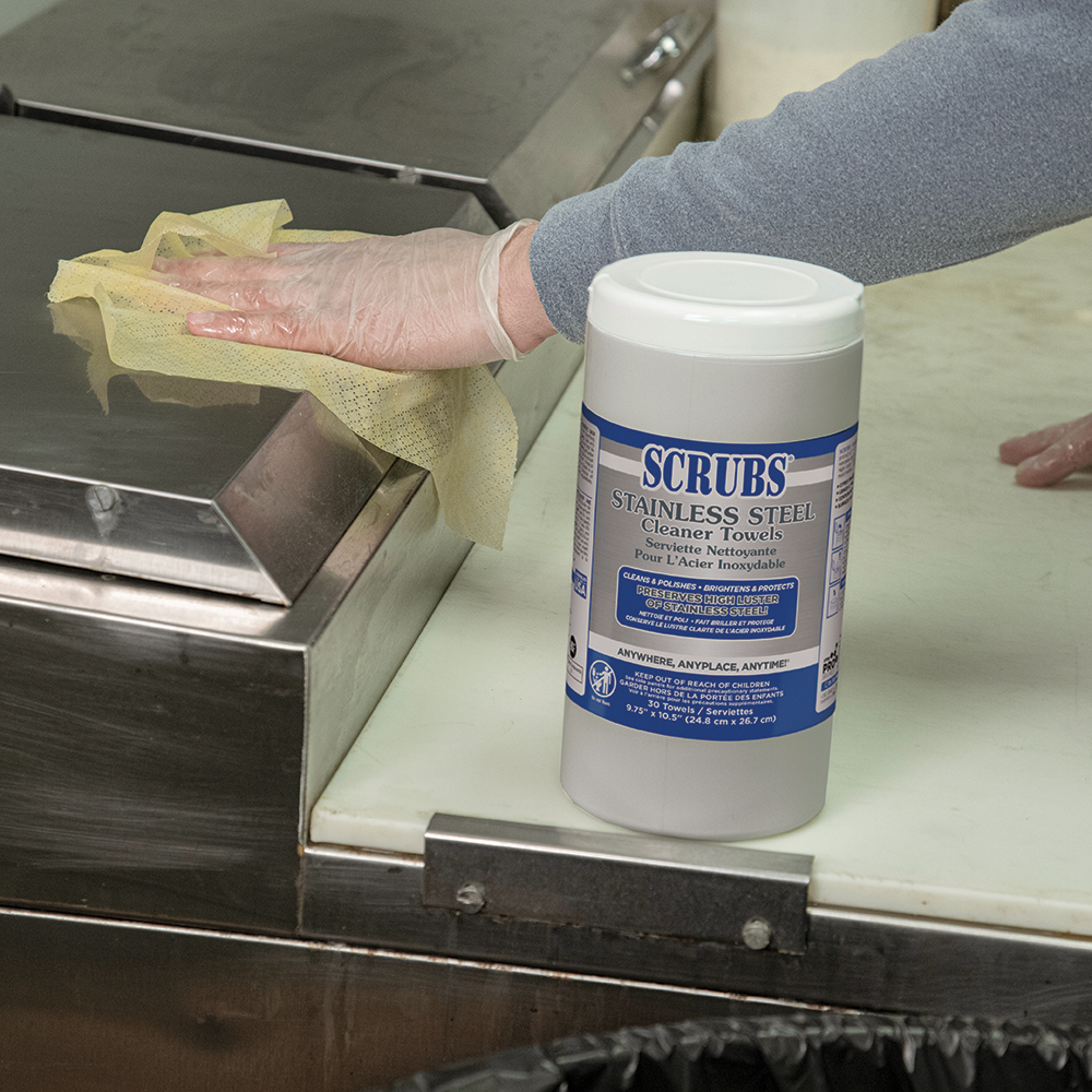 SCRUBS Stainless Steel Cleaner Towels being used to clean and polish a stainless steel surface in a 